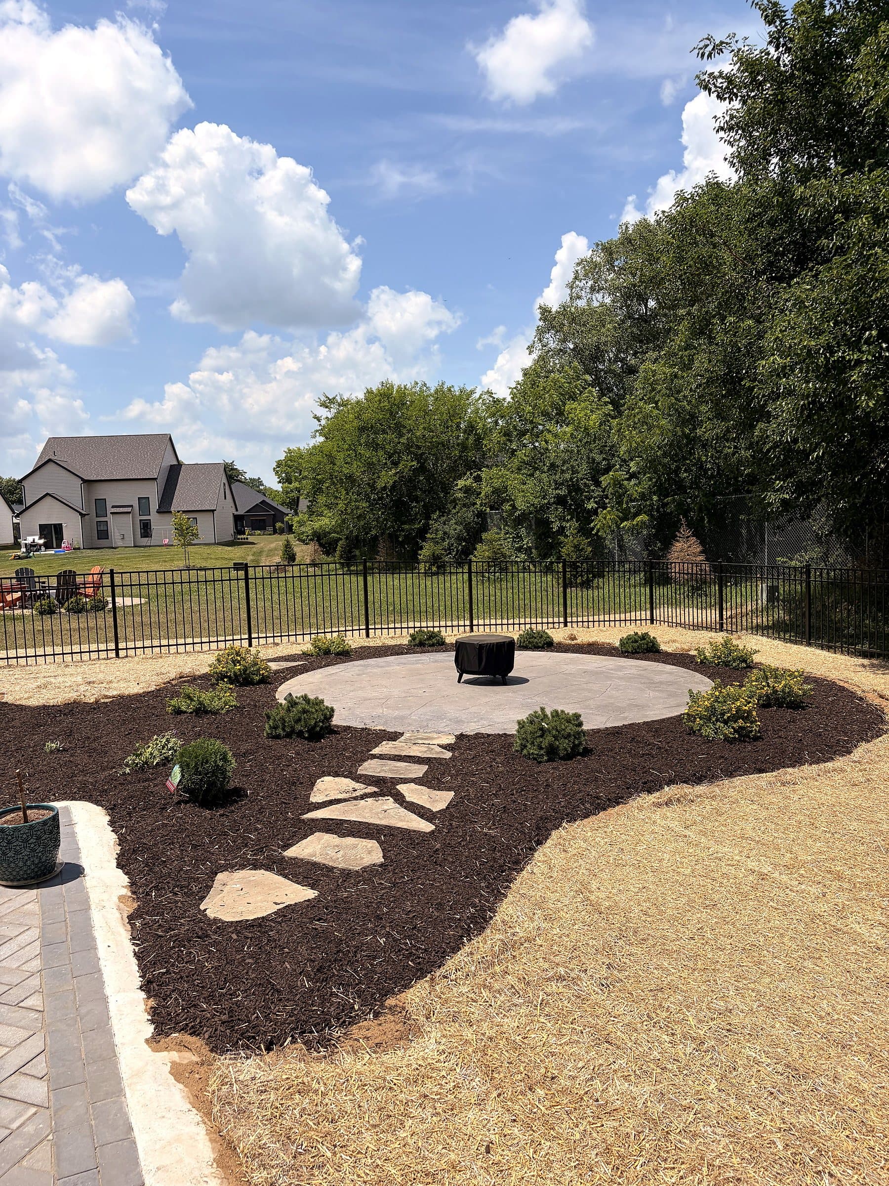 Patio-side planting bed and landscape installation