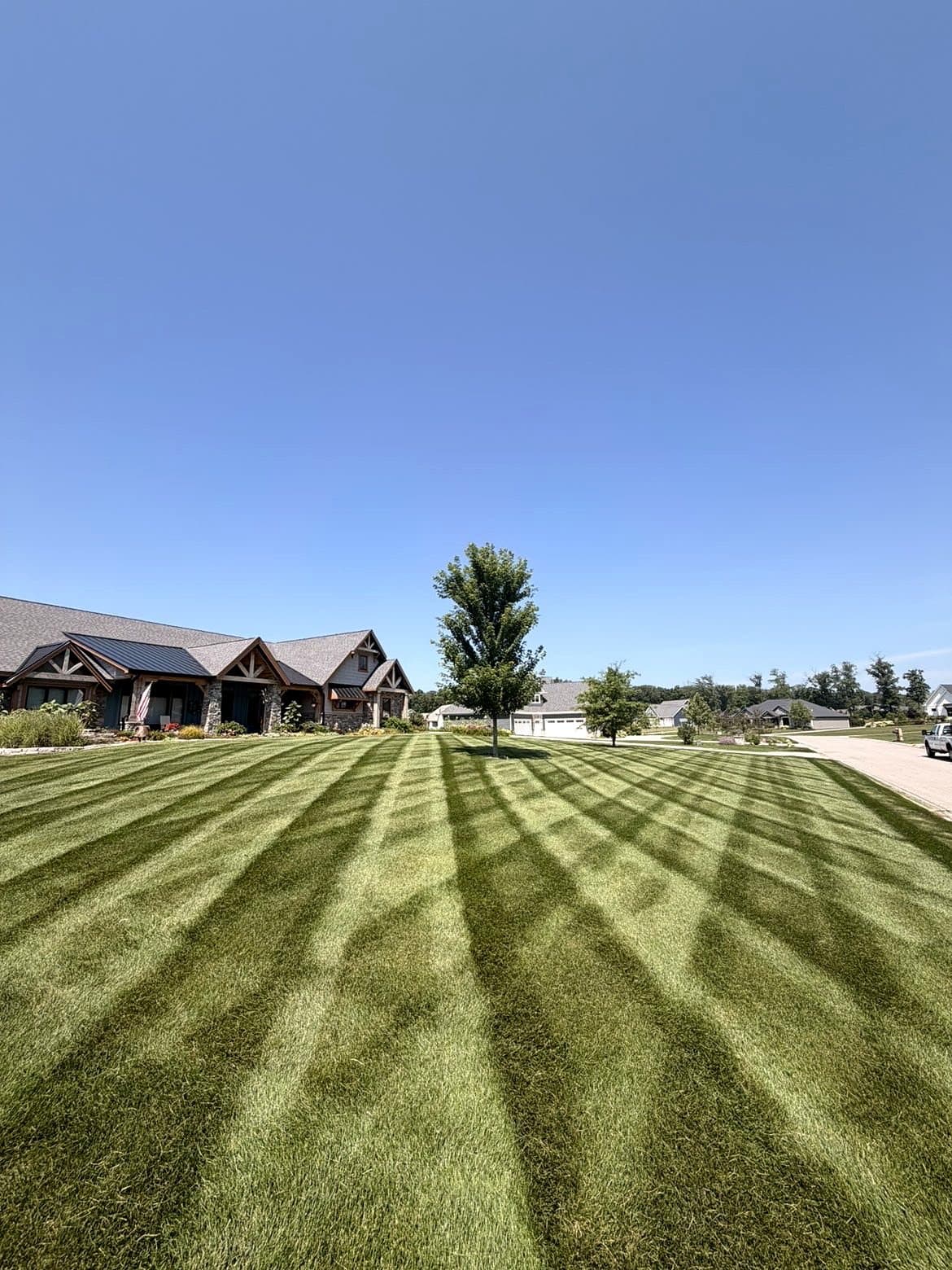 Detailed mowing and striping along a neighborhood property