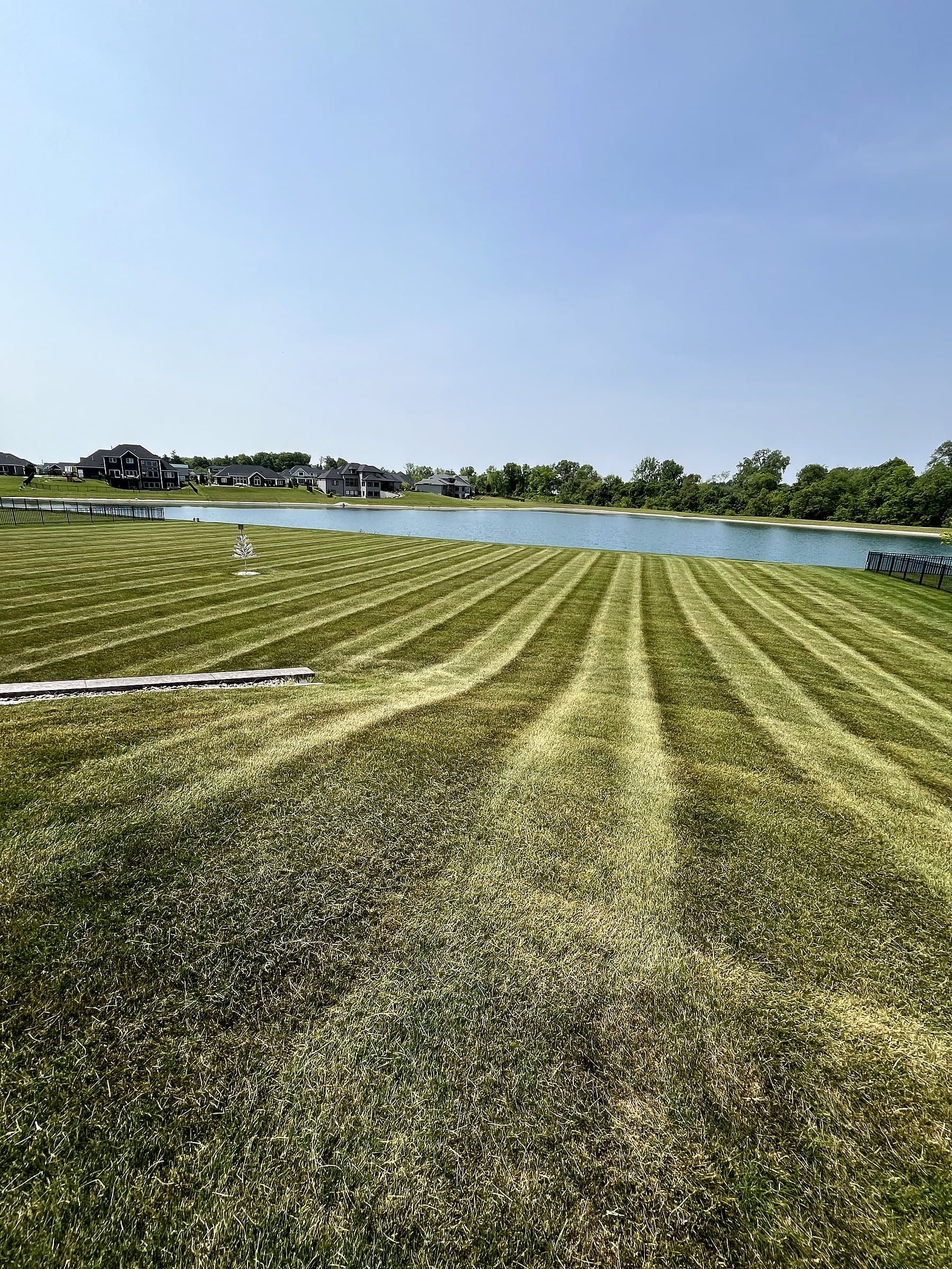 Large-property mowing with long, consistent stripes