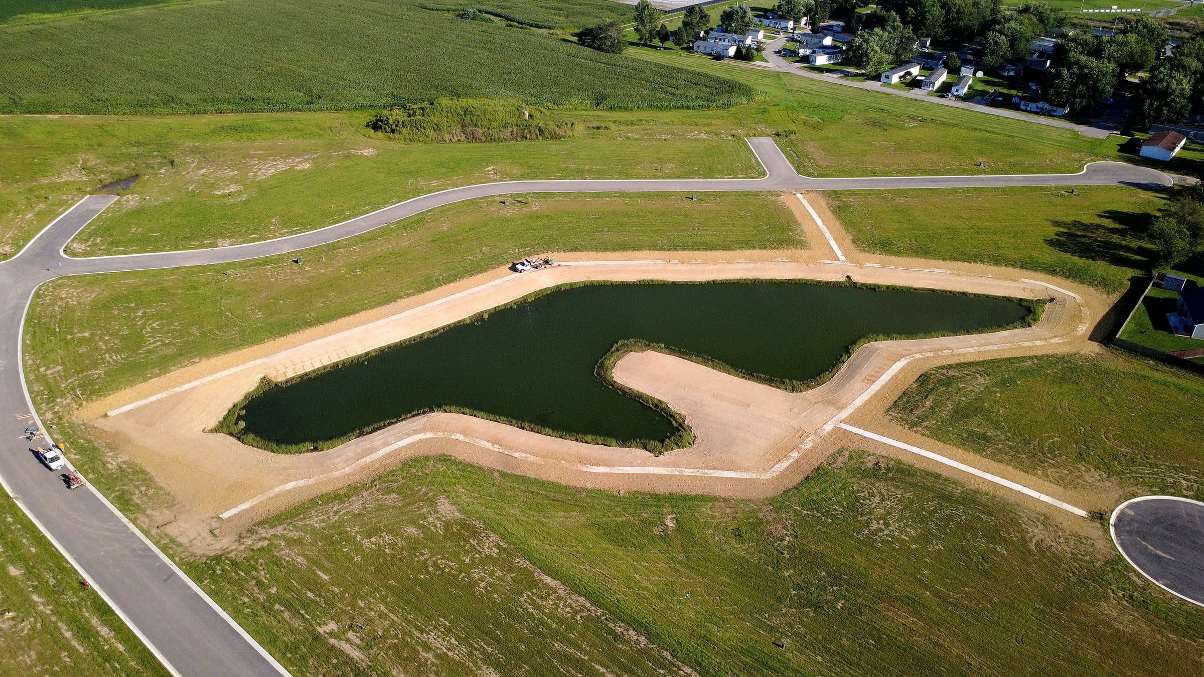 Aerial view of stabilized pond banks and surrounding lots
